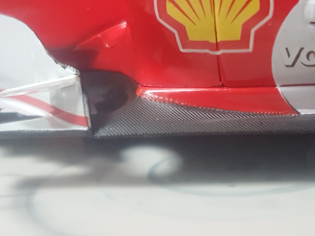 Textured carbon fiber. By Hot Wheels indeed.